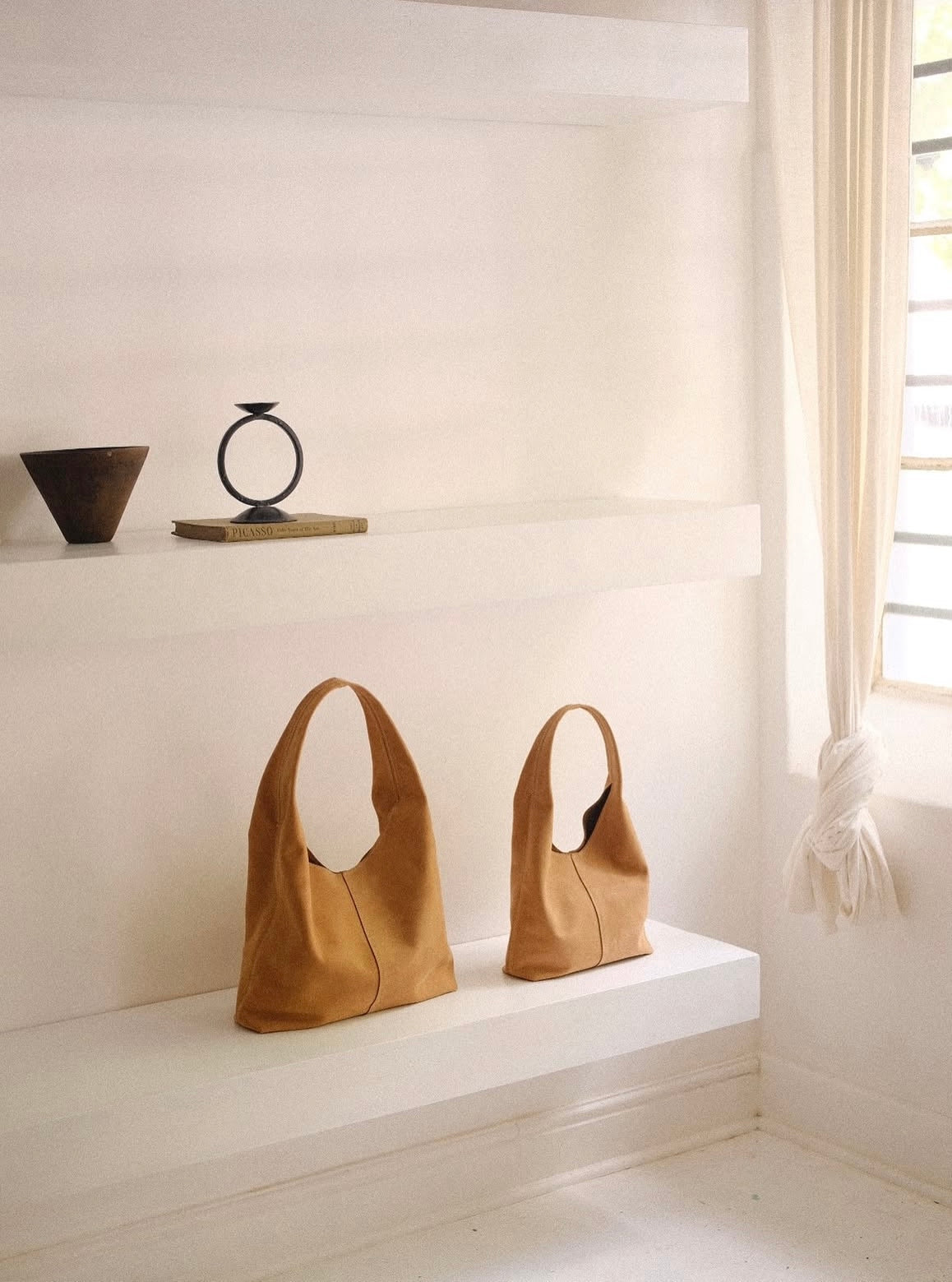 THE EVOLUTION OF LEATHER BAGS